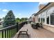 Elevated deck with ample seating offering lush green views, perfect for outdoor enjoyment at 9232 Rockport Ln, Highlands Ranch, CO 80126