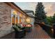 Cozy back deck with comfortable seating and a fire pit, perfect for relaxing evenings at 9232 Rockport Ln, Highlands Ranch, CO 80126