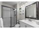 Bathroom featuring walk-in shower, modern vanity, and sleek fixtures at 9232 Rockport Ln, Highlands Ranch, CO 80126