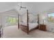 Inviting bedroom with large windows, vaulted ceiling, and plush carpet at 9232 Rockport Ln, Highlands Ranch, CO 80126