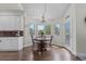 Cozy breakfast nook bathed in natural light, showcasing a charming chandelier at 9232 Rockport Ln, Highlands Ranch, CO 80126