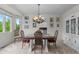 Traditional dining room featuring a chandelier, wood table and matching chairs at 9232 Rockport Ln, Highlands Ranch, CO 80126