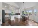 Spacious eat-in kitchen offers an island, stainless appliances, and modern finishes at 9232 Rockport Ln, Highlands Ranch, CO 80126