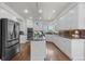Bright and airy kitchen with large island, stainless steel appliances, and ample cabinet space at 9232 Rockport Ln, Highlands Ranch, CO 80126