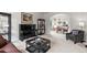 Cozy living room with plush carpeting, fireplace, and arched doorway to dining area at 9232 Rockport Ln, Highlands Ranch, CO 80126