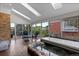 Relaxing sunroom featuring a hot tub, skylights, and views of the backyard at 9232 Rockport Ln, Highlands Ranch, CO 80126