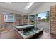 Inviting sunroom with a hot tub and views of the landscape at 9232 Rockport Ln, Highlands Ranch, CO 80126
