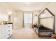 A delightful bedroom featuring a unique house-shaped bed frame and a bright, inviting atmosphere at 10100 Isle St, Parker, CO 80134