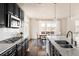 Bright kitchen featuring stainless steel appliances and a dining area with natural light at 10100 Isle St, Parker, CO 80134