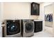 Functional laundry room equipped with modern washer and dryer, plus storage at 10100 Isle St, Parker, CO 80134