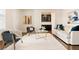 Cozy living room showcasing hardwood floors, modern seating, and elegant accents at 10100 Isle St, Parker, CO 80134