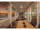 Covered patio with outdoor seating and sunset views overlooking the lush landscape at 10100 Isle St, Parker, CO 80134