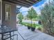 Small front patio with table and chairs, and view of street at 2330 Uinta St, Denver, CO 80238