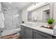 Bathroom with modern fixtures, a walk-in shower with marble-look tile and a square vessel sink at 15246 W 94Th Ave, Arvada, CO 80007