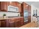 The kitchen features stainless steel appliances, a gas cooktop, and dark wood cabinetry at 15246 W 94Th Ave, Arvada, CO 80007