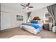 Cozy main bedroom featuring a bed with decorative pillows, side tables, and a serene atmosphere at 15246 W 94Th Ave, Arvada, CO 80007