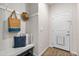 Cozy mudroom with storage bench, coat hooks, decorative pillows, and a convenient entryway at 15246 W 94Th Ave, Arvada, CO 80007