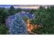 Backyard view, showcasing a patio, landscaping, and mountain views at 3351 Oak St, Wheat Ridge, CO 80033