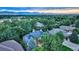 Aerial view of house with mountain views and lush green surroundings at 3351 Oak St, Wheat Ridge, CO 80033