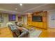 Finished basement rec room with media cabinet at 3351 Oak St, Wheat Ridge, CO 80033