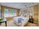 Bright bedroom with large map wall art and comfy bed at 3351 Oak St, Wheat Ridge, CO 80033
