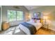 Bedroom with large window and neutral decor at 3351 Oak St, Wheat Ridge, CO 80033