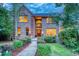 Inviting two-story brick house with a nicely landscaped front yard at 3351 Oak St, Wheat Ridge, CO 80033