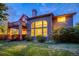 Two-story house with large windows, balcony, and landscaped yard at 3351 Oak St, Wheat Ridge, CO 80033