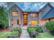 Two-story brick house with a welcoming entryway and landscaping at 3351 Oak St, Wheat Ridge, CO 80033