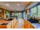 Open kitchen with granite countertops, ample cabinetry, and a breakfast bar at 3351 Oak St, Wheat Ridge, CO 80033