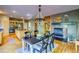 Kitchen boasts a breakfast nook and fireplace, ideal for entertaining at 3351 Oak St, Wheat Ridge, CO 80033