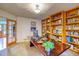 Bright office space with hardwood floors, built-in shelving, and natural light at 3351 Oak St, Wheat Ridge, CO 80033