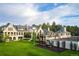 Aerial view showcasing a luxury estate with lush lawn, swimming pool, sport court, and playground at 4603 S Denice Dr, Cherry Hills Village, CO 80111