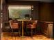 A stylish bar area featuring leather chairs, elegant decor, and a great selection of wines at 4603 S Denice Dr, Cherry Hills Village, CO 80111