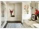 Bright bathroom featuring dual sinks, marble countertops, and a floral accent at 4603 S Denice Dr, Cherry Hills Village, CO 80111