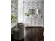 Bathroom featuring a vanity with floral wallpaper and dark wood flooring at 4603 S Denice Dr, Cherry Hills Village, CO 80111