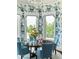 Charming dining room with floral wallpaper, and bright, natural light at 4603 S Denice Dr, Cherry Hills Village, CO 80111