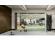 Well-equipped home gym with mirrored walls, weights, and modern exercise equipment at 4603 S Denice Dr, Cherry Hills Village, CO 80111