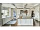 Bright, open kitchen with a large island, custom cabinetry, and modern appliances at 4603 S Denice Dr, Cherry Hills Village, CO 80111