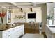 Spacious open-concept kitchen with a large island and adjoins a comfortable living area at 4603 S Denice Dr, Cherry Hills Village, CO 80111