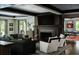Welcoming living room with cozy seating, fireplace, and open access to game room at 4603 S Denice Dr, Cherry Hills Village, CO 80111