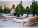 Inviting outdoor patio with comfortable seating and a modern fire pit feature at 4603 S Denice Dr, Cherry Hills Village, CO 80111