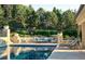 Beautiful swimming pool with elegant lounge furniture and landscaped surroundings at 4603 S Denice Dr, Cherry Hills Village, CO 80111