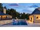 Swimming pool with elegant patio area and surrounding lush landscaping at 4603 S Denice Dr, Cherry Hills Village, CO 80111
