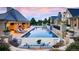 Luxury backyard with large pool, covered outdoor kitchen, lounge chairs, and mature landscaping at 4603 S Denice Dr, Cherry Hills Village, CO 80111