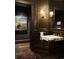 Elegant powder room with a marble sink and artistic decor at 4603 S Denice Dr, Cherry Hills Village, CO 80111