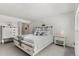 Bright bedroom with white furniture, carpeted floors, and lots of natural light at 12979 W Ohio Ave, Lakewood, CO 80228