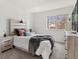 Inviting bedroom with stylish furniture, soft lighting, and large window at 12979 W Ohio Ave, Lakewood, CO 80228
