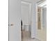 Walk-in closet featuring open shelving and access to a bathroom with a glass shower at 12979 W Ohio Ave, Lakewood, CO 80228
