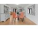 Cozy dining area features hardwood floors and a glass table at 12979 W Ohio Ave, Lakewood, CO 80228